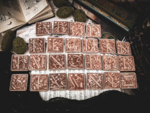 Square birch wood magnets featuring Hans Holbein the Younger's Danse Macabre alphabet woodcuts from 1523.