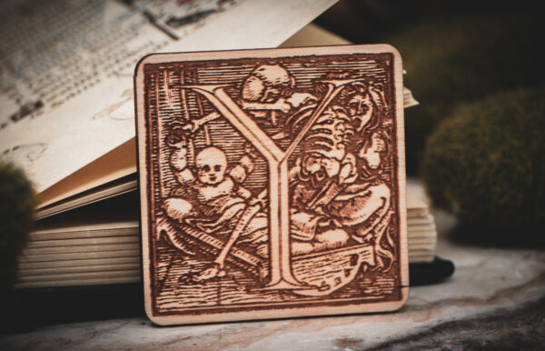 Square birch wood magnet featuring Hans Holbein the Younger's Danse Macabre alphabet letter Y woodcut from 1523.