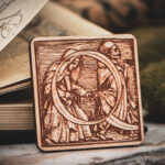 Square birch wood magnet featuring Hans Holbein the Younger's Danse Macabre alphabet letter Q woodcut from 1523.