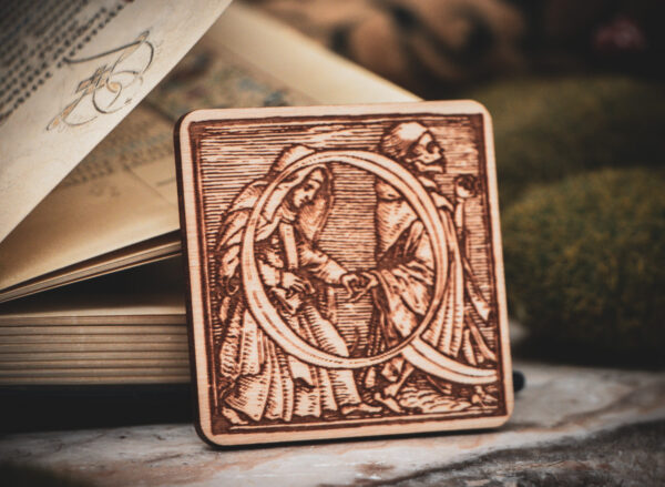 Square birch wood magnet featuring Hans Holbein the Younger's Danse Macabre alphabet letter Q woodcut from 1523.