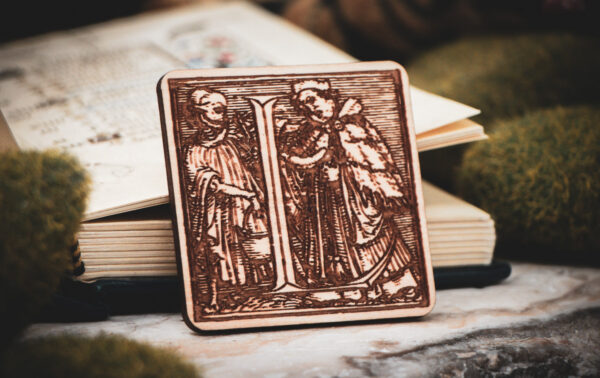 Square birch wood magnet featuring Hans Holbein the Younger's Danse Macabre alphabet letter L woodcut from 1523.