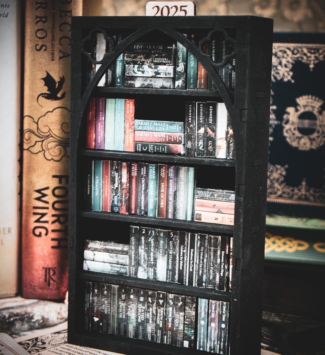 Miniature gothic bookshelf filled with mini 3D printed books